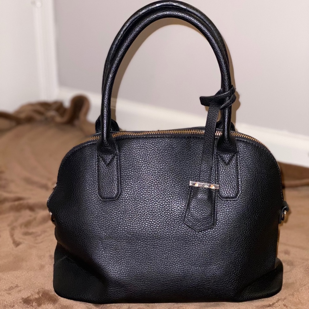 Black dome shaped handbag